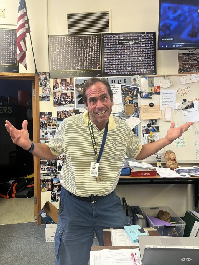 Scotty G stands in his classroom P2, showing off his charger pride. His love for our school isn’t anything new. For the past thirty three years, Scott has bled blue and gold and connected with many DP students. (Picture by Shira Brody)