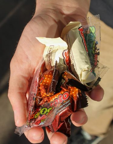 A handful of candies that can be found at a convenience store.