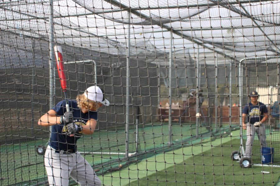 Baseball is getting ready for their spring season by practicing early on. Jacob Danley (11) and Jonathan Rodgers (11) at the batting cage practicing their swing.