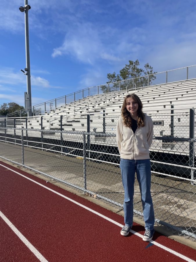 Ila Walman-Randall standing on the track at the Scott O’Leery Stadium. Ila does Track and Field at Dos Pueblos.
