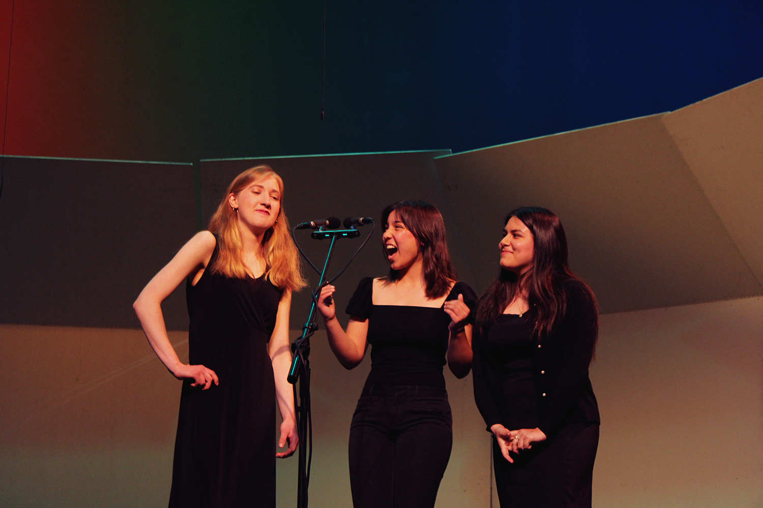 Aislinn Wilson, Nicole Barger, and Valeria Tiburcio Romo (from left to right) sing 9 to 5.