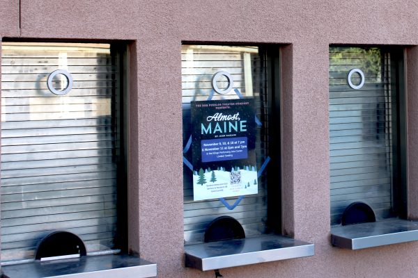 A poster up for the fall play Almost, Maine at the Elings Performing Arts Center.