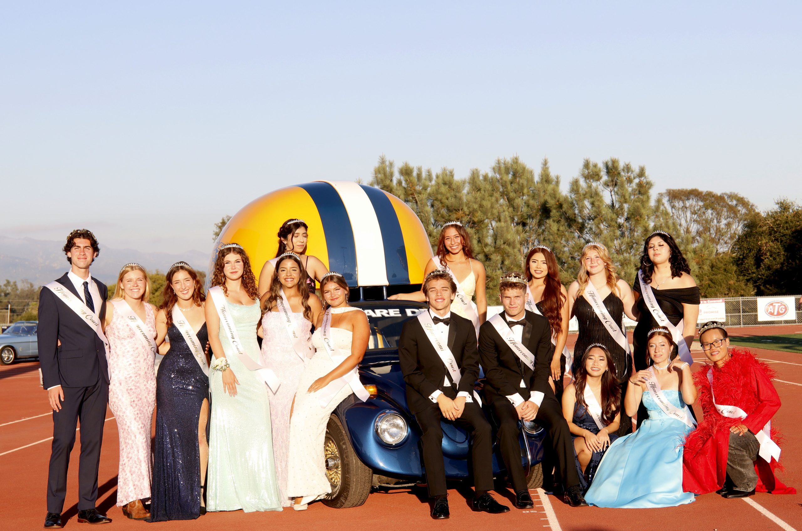 The homecoming court poses together in their formal attire before the game started.