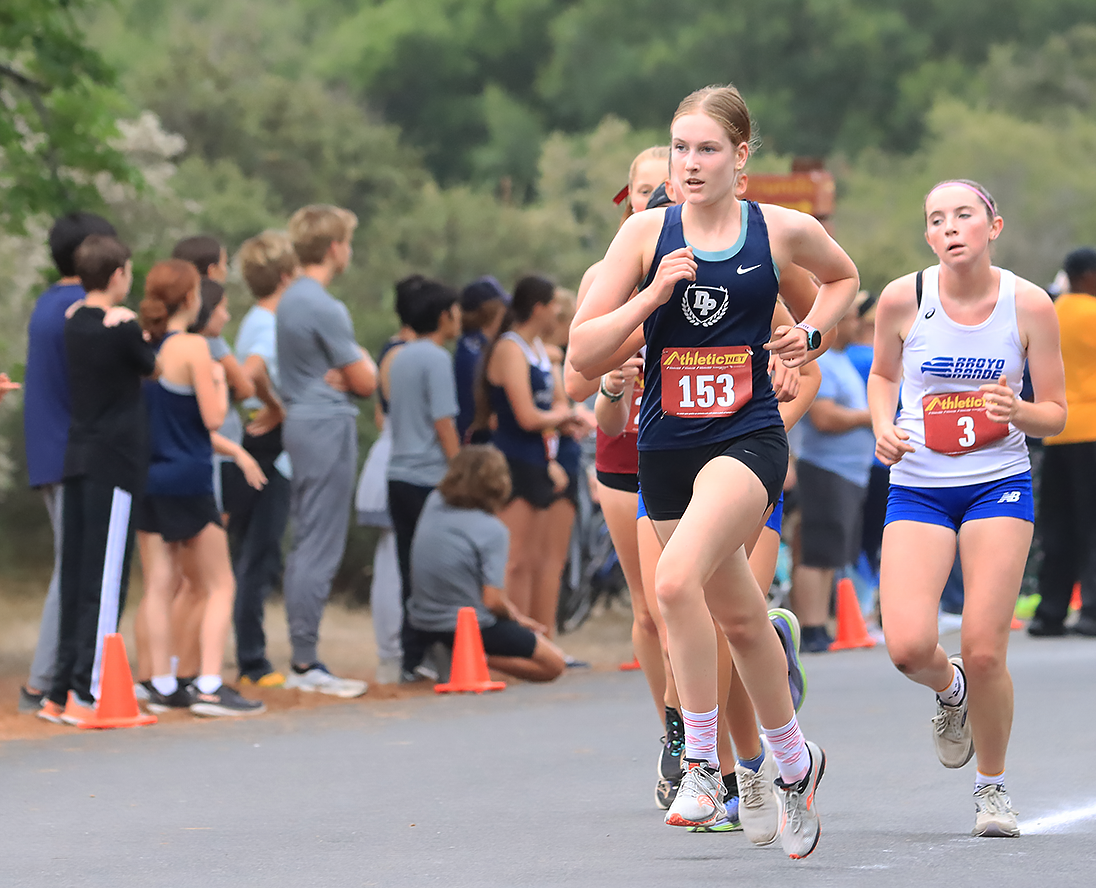 Cate Bishop (11) competing in a cross country race during 23-24 season.