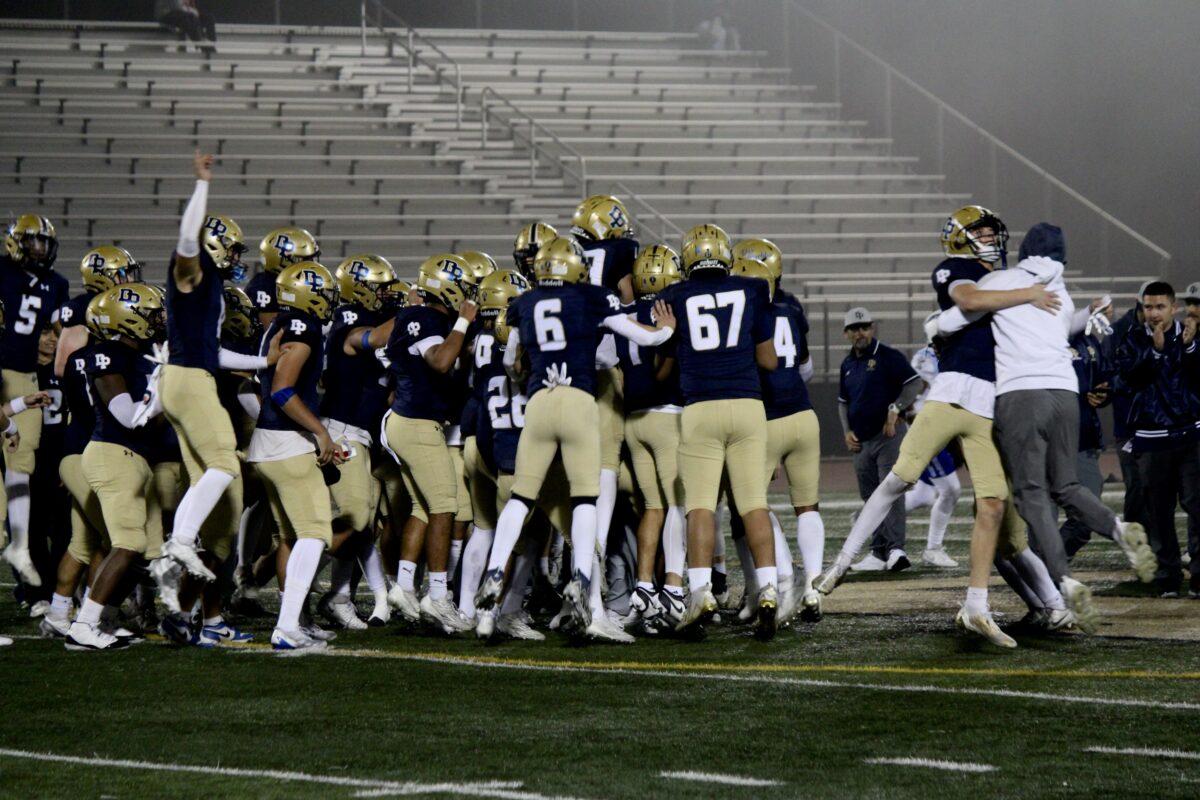 The Chargers celebrate after winning the game that is taking them to the CIF playoffs.