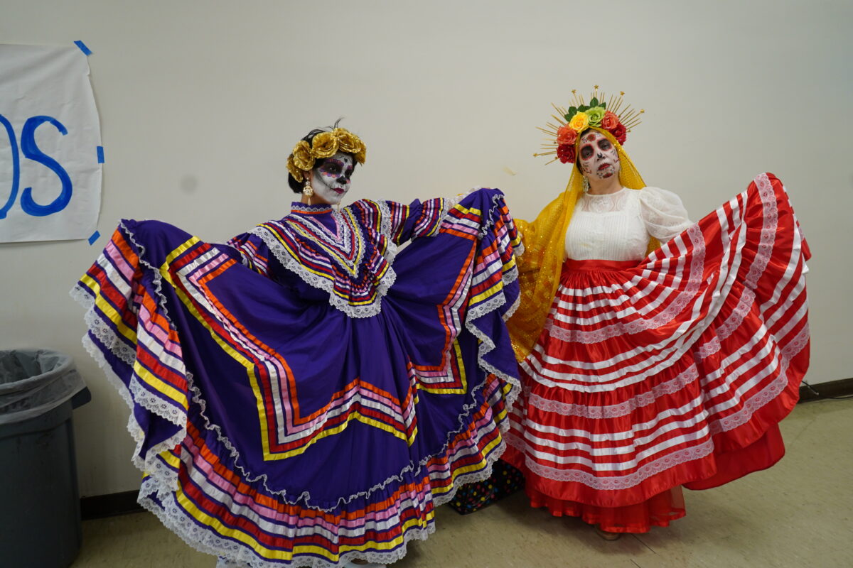 Two performers arriving at DPHS’s cafeteria, preparing to dance Folklórico.