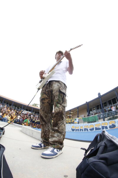 Carter Low (12) plays "Thunderstruck" by AC/DC to start out the Fall Pep Rally.