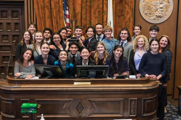 Coaches and students of the DPHS Mock Trial Team A posing with the Santa Barbara County competition trophy