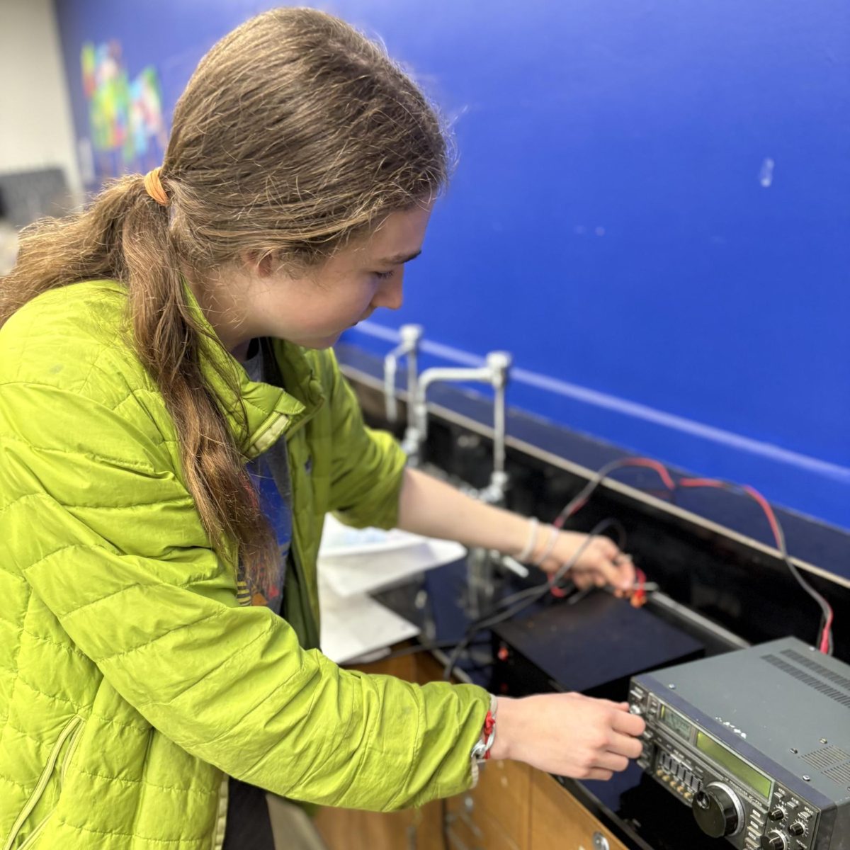 Malachi Cottrell (10) demonstrates tuning a radio.