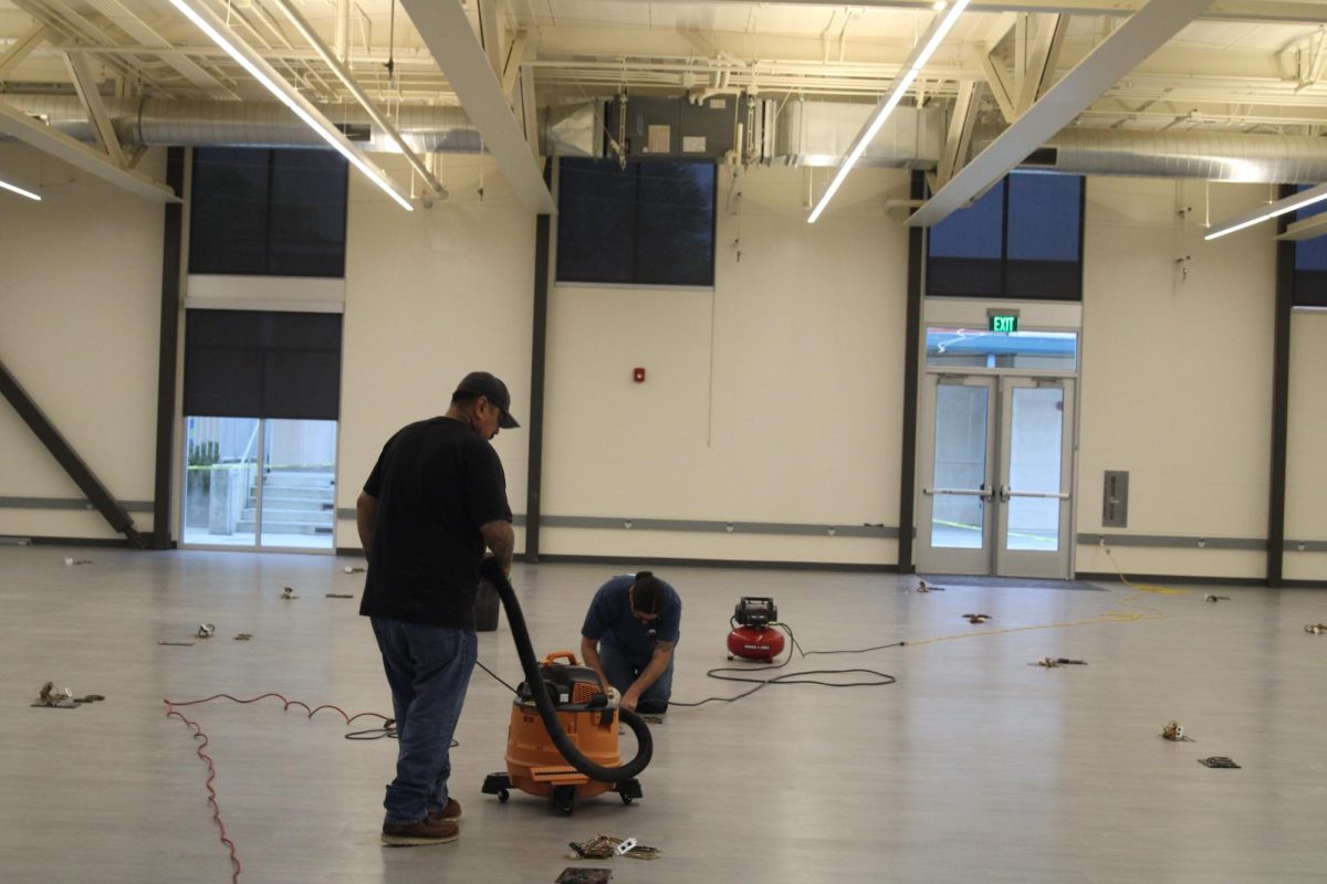 Workers adding finishing touches to the floor 