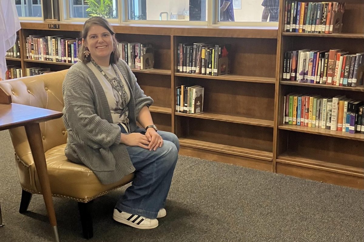 Alexa Levesque sitting in DPHS library 