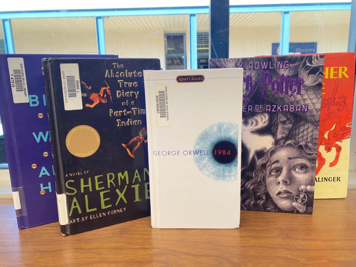A couple banned books in the the Dos Pueblos High School library including “1984” by George Orwell, “The Absolutely True Diary of a Part-Time Indian” by Sherman Alexie, ”Harry Potter, Prisoner of Azkaban” by J.K. Rowling, “Catcher in the Rye” by J.D. Salinger, and “Brave New World” by Aldous Huxley 