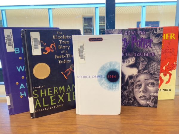 A couple banned books in the the Dos Pueblos High School library including “1984” by George Orwell, “The Absolutely True Diary of a Part-Time Indian” by Sherman Alexie, ”Harry Potter, Prisoner of Azkaban” by J.K. Rowling, “Catcher in the Rye” by J.D. Salinger, and “Brave New World” by Aldous Huxley 