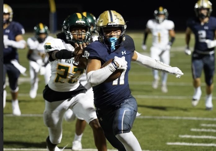 Micah Barnhart (12) breaks free for big gain against Royal High School