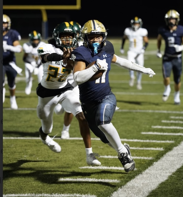Micah Barnhart (12) breaks free for big gain against Royal High School