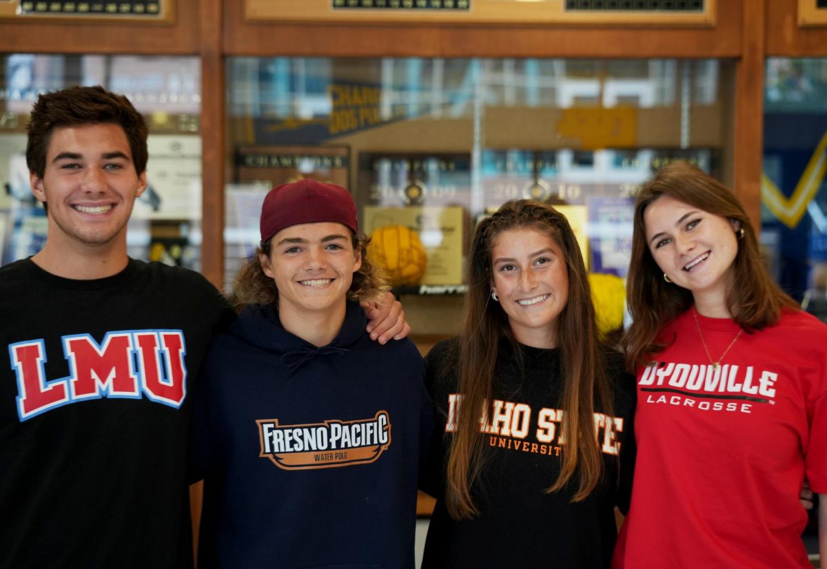 (Left to Right) DPHS seniors in their committed college gear:  Ben Fuhrer,  Aricin Marshall, Anastasia Brunner, and Linnea Clapinski.