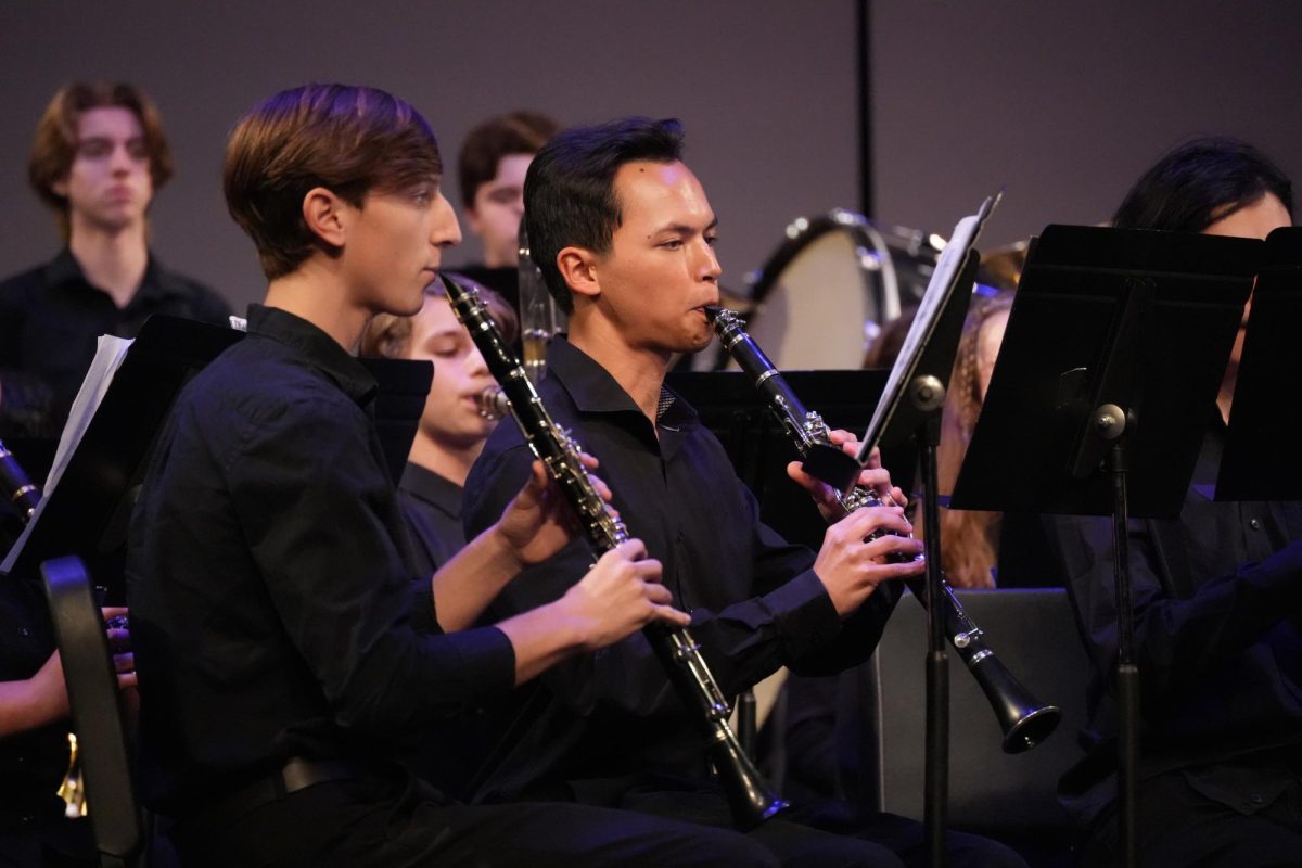 Ben Minor (12) and Dylan Ewing (12) playing the clarinet during a concert.