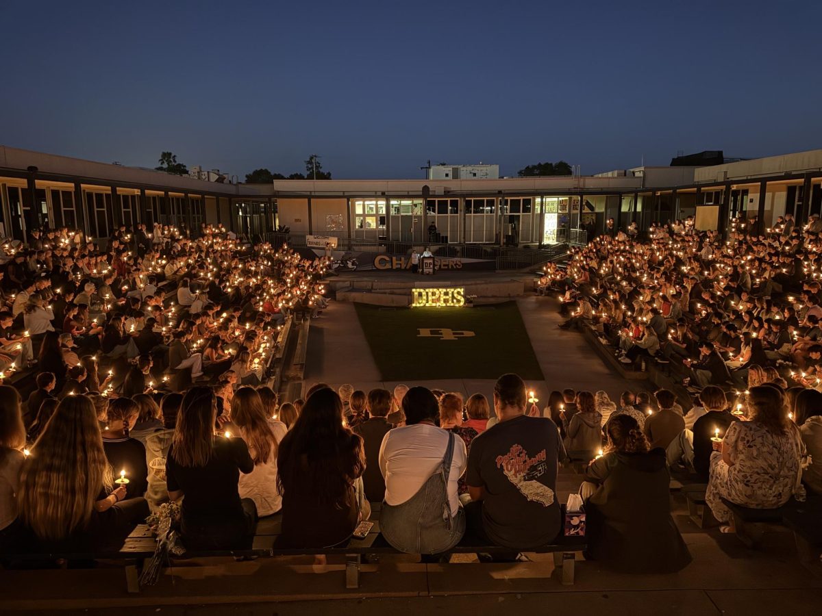 DPHS students and families gathered together during 2025 candle light vigil.