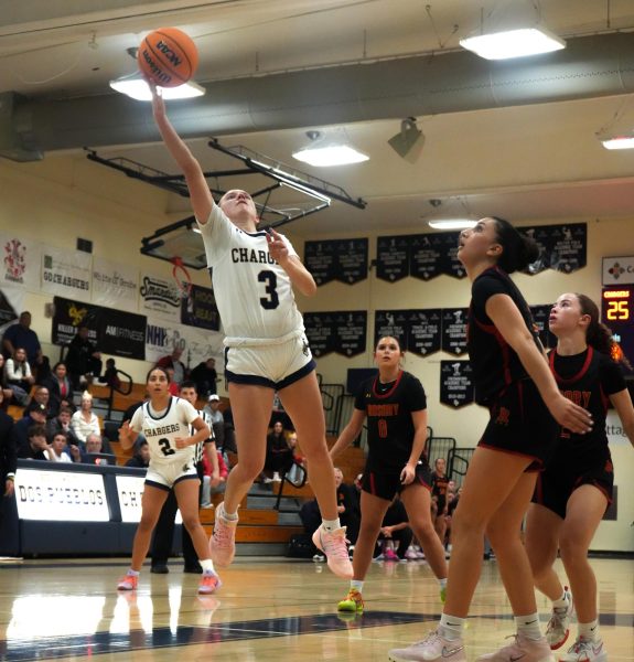 Carly Letendre (12) going up for a layup against Rosary Academy.
