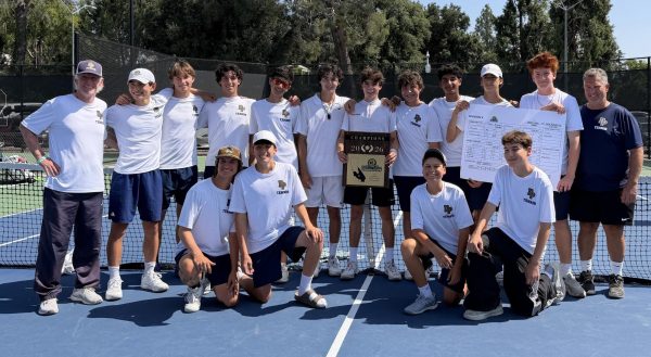 The varsity team poses with their award at championships.