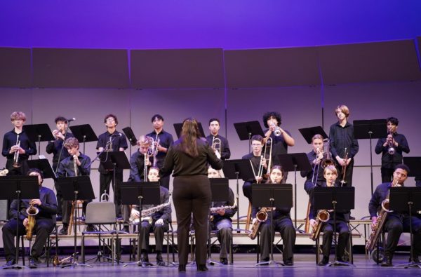 Band students perform onstage.