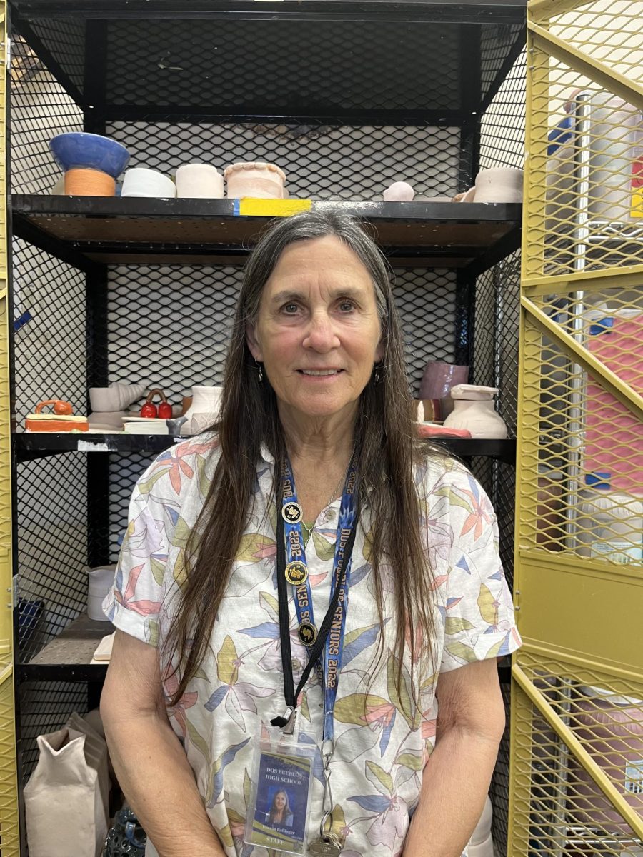 Ms. Bollinger sits in her classroom.